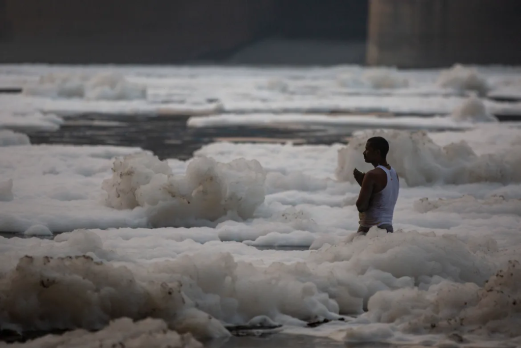Hindus bathe in India's sacred Yamuna covered with toxic foam