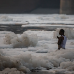 Hindus bathe in India's sacred Yamuna covered with toxic foam
